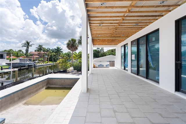 view of patio featuring a water view