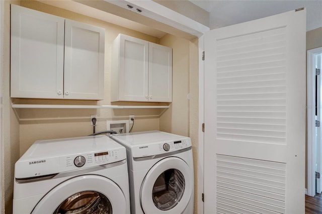 laundry area with washing machine and dryer and cabinet space