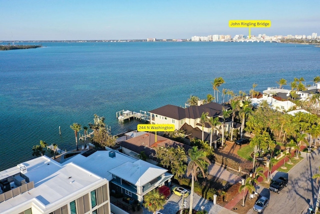 birds eye view of property with a water view