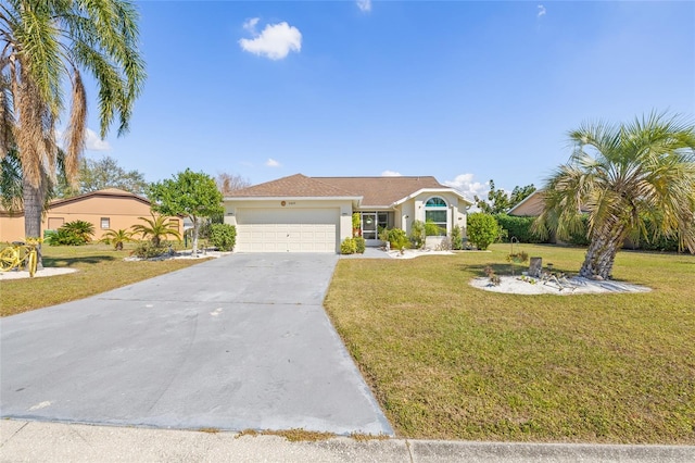 view of front of house with a garage and a front yard