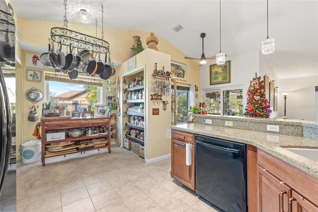 kitchen with lofted ceiling, light tile patterned floors, black dishwasher, light stone counters, and decorative light fixtures