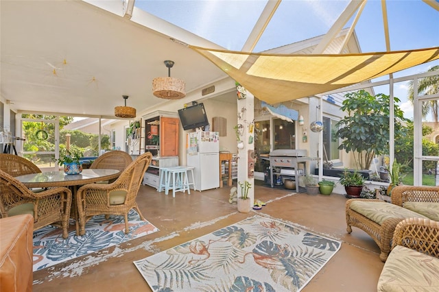 sunroom featuring a skylight