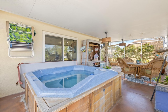 view of patio / terrace featuring a hot tub