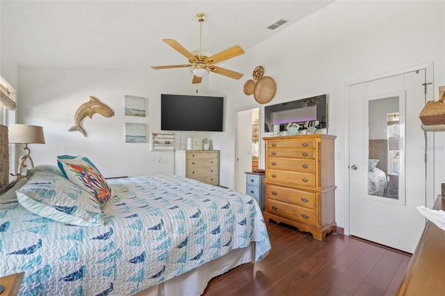 bedroom featuring ceiling fan, dark hardwood / wood-style floors, and vaulted ceiling