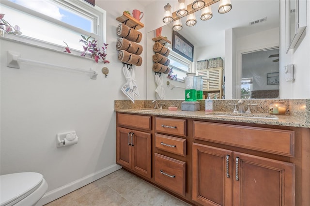 bathroom with tile patterned floors, toilet, and vanity