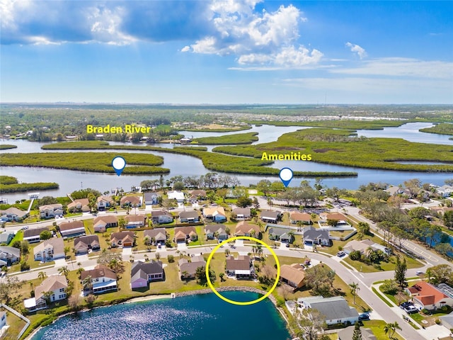 birds eye view of property with a water view