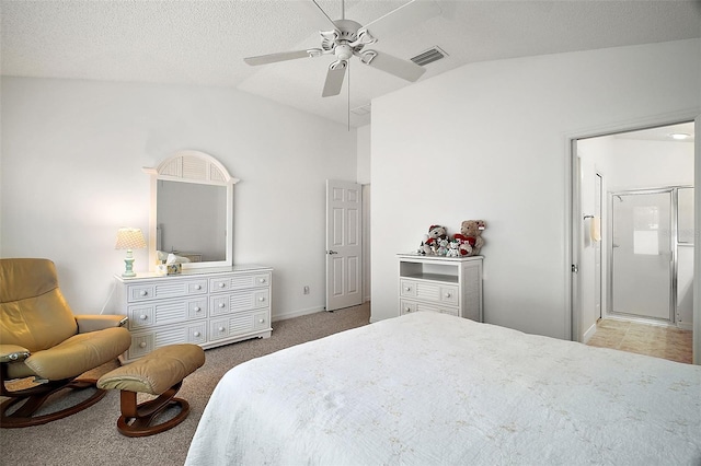 carpeted bedroom featuring a textured ceiling, vaulted ceiling, and ceiling fan