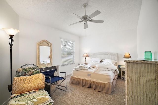 bedroom featuring ceiling fan, carpet flooring, and a textured ceiling