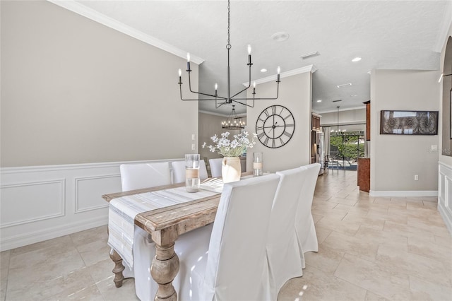 dining room with an inviting chandelier, crown molding, and a textured ceiling