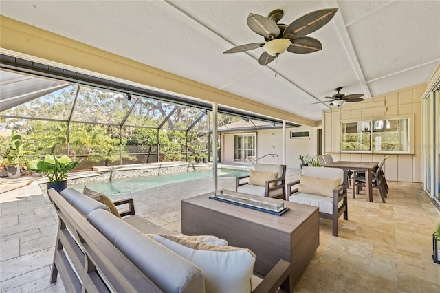 view of patio / terrace with outdoor lounge area, ceiling fan, and a lanai