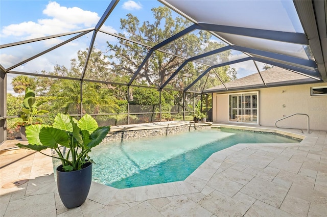 view of pool with a lanai, a jacuzzi, and a patio