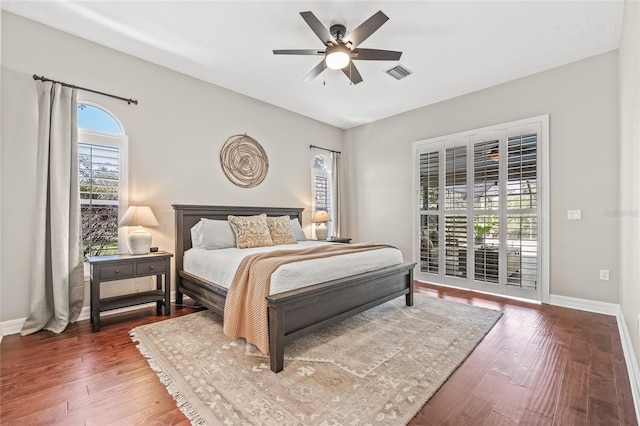 bedroom with hardwood / wood-style floors and ceiling fan