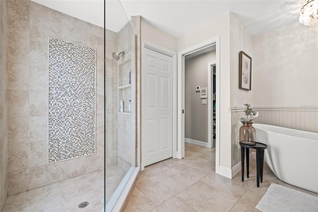 bathroom with plus walk in shower and a chandelier