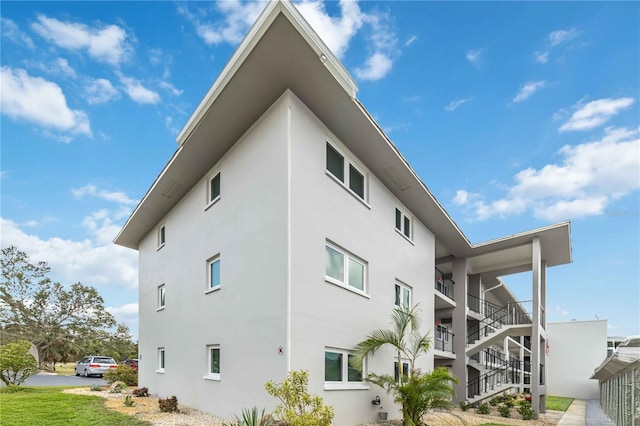 view of side of home with a balcony