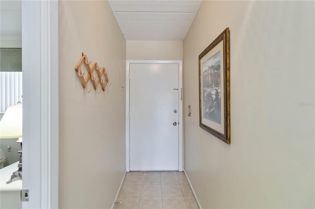 entryway with light tile patterned flooring