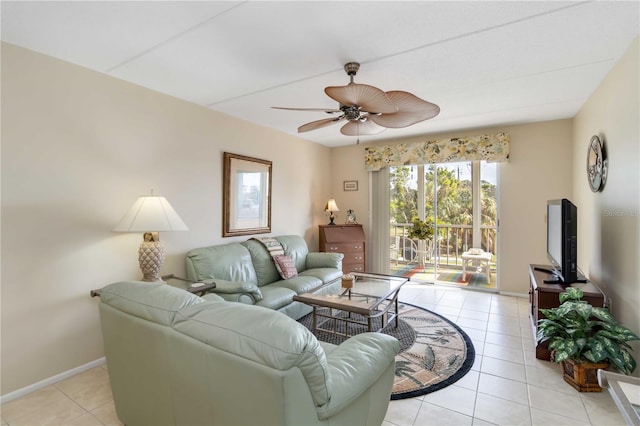 tiled living room featuring ceiling fan