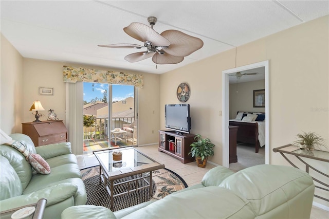 tiled living room featuring ceiling fan