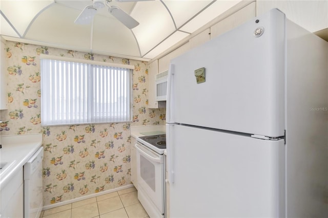 kitchen featuring ceiling fan, white appliances, white cabinetry, and light tile patterned floors