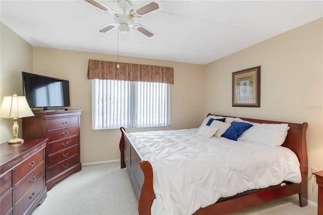 bedroom with ceiling fan and light carpet