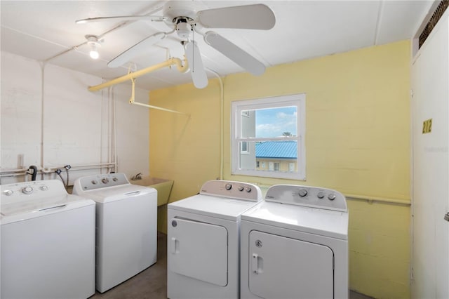 clothes washing area featuring washer and dryer, sink, and ceiling fan