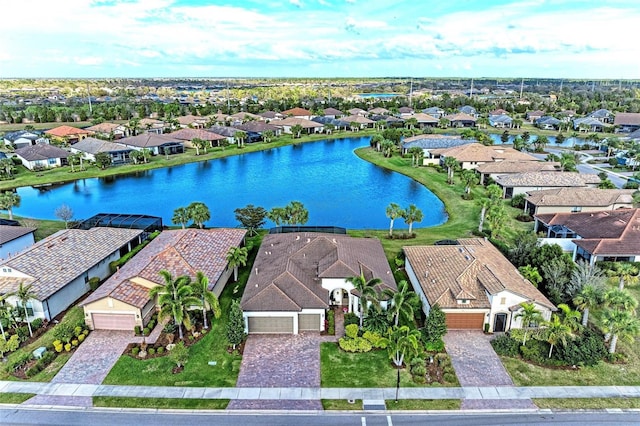 bird's eye view with a residential view and a water view