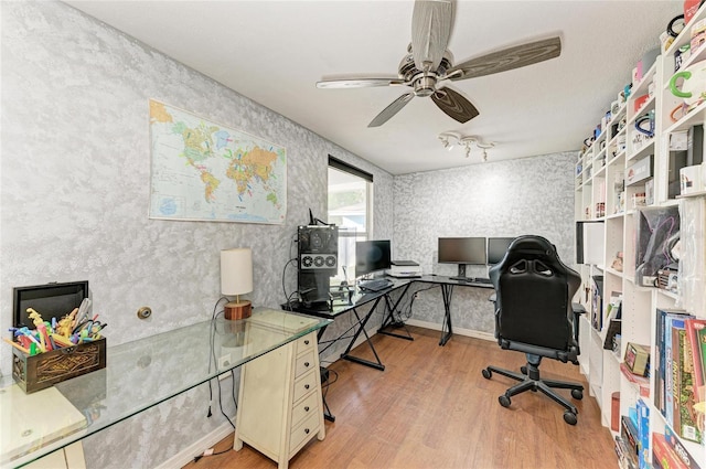 office space with hardwood / wood-style flooring and ceiling fan