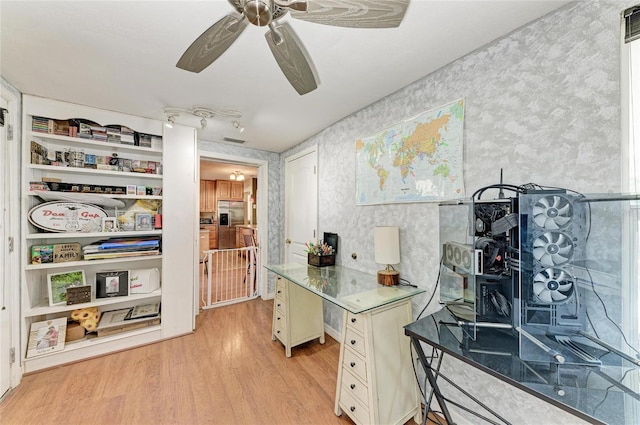 kitchen with stainless steel refrigerator with ice dispenser, ceiling fan, and light hardwood / wood-style flooring