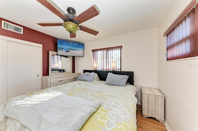 bedroom featuring ceiling fan and light wood-type flooring