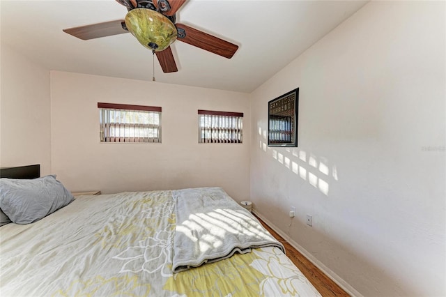 bedroom featuring ceiling fan and wood-type flooring