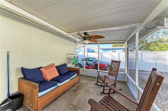 sunroom / solarium featuring ceiling fan and wooden ceiling