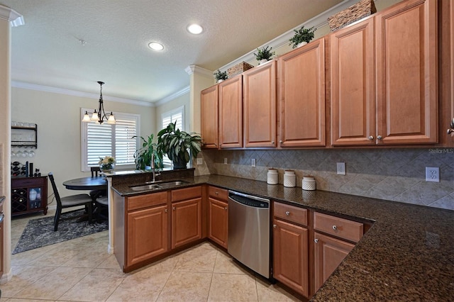 kitchen featuring pendant lighting, dishwasher, sink, and decorative backsplash