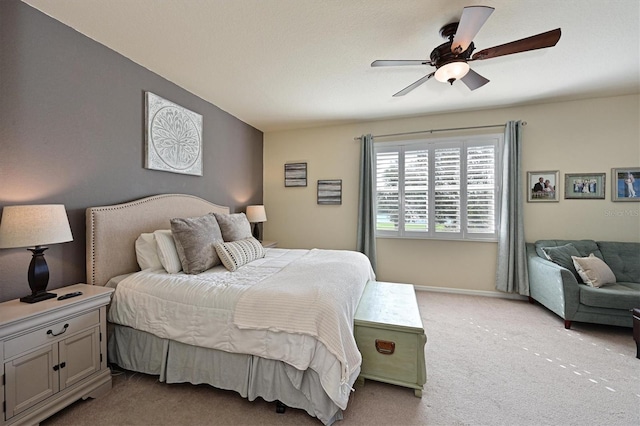 bedroom with light carpet and ceiling fan