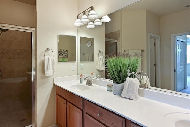 bathroom with an enclosed shower and vanity