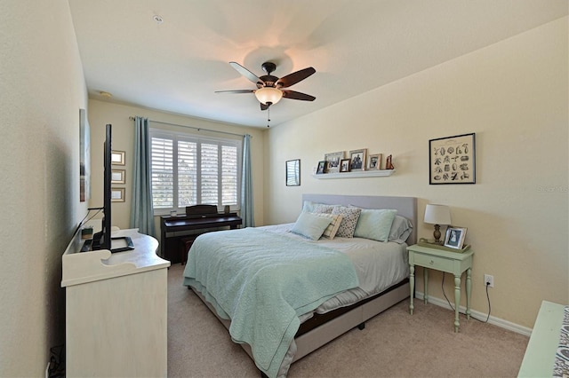 bedroom with light colored carpet and ceiling fan