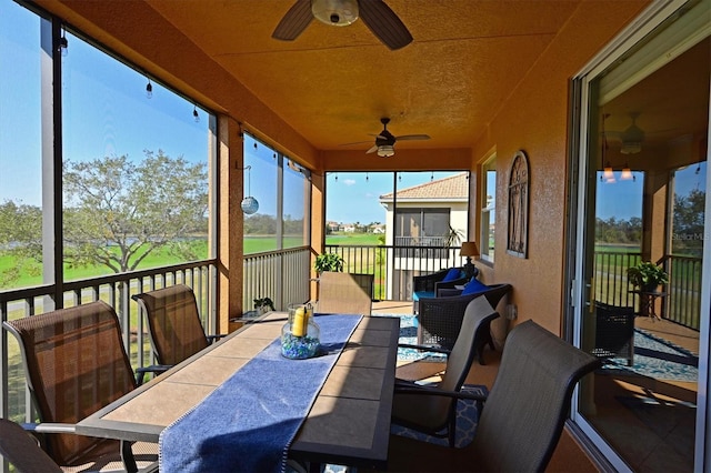 sunroom / solarium with ceiling fan