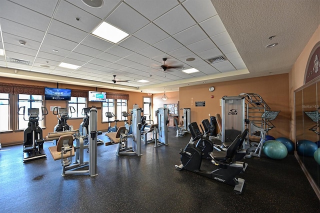 workout area with a paneled ceiling