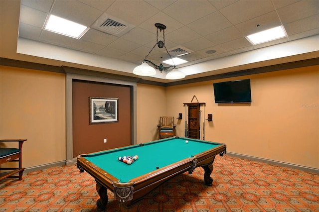 recreation room featuring pool table, a paneled ceiling, a tray ceiling, and light carpet