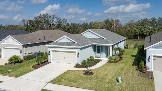 view of front of house with a garage, central AC, a front lawn, and a porch