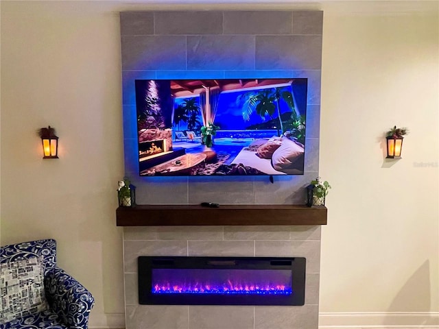 interior details featuring a glass covered fireplace