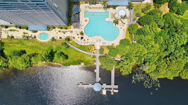 birds eye view of property with a water view