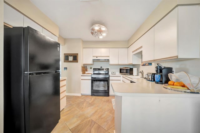 kitchen featuring sink, white cabinetry, range with electric stovetop, black refrigerator, and kitchen peninsula