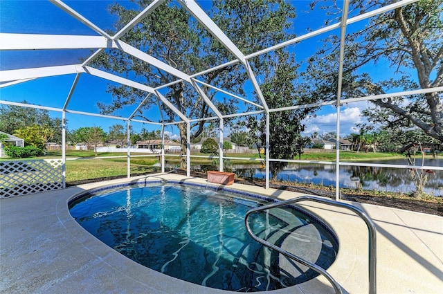 view of pool featuring a water view, a yard, a lanai, and a patio