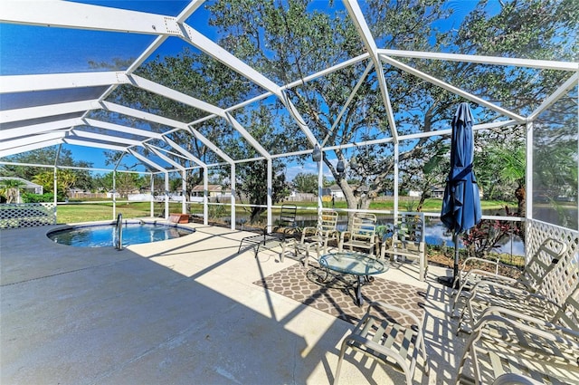 view of pool with a lanai and a patio area