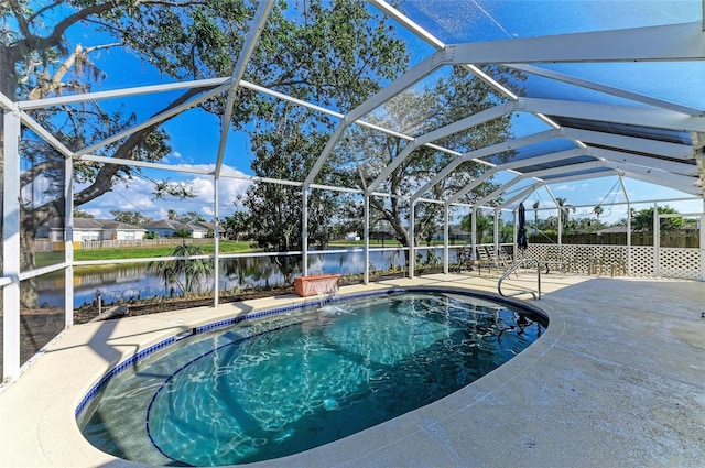 outdoor pool with a lanai, a patio, and a water view