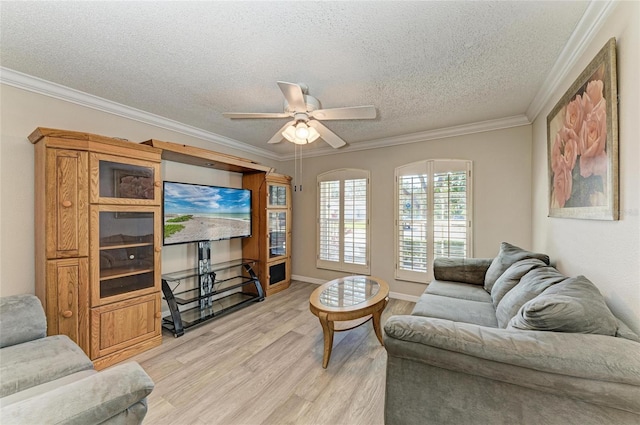 living room featuring ornamental molding, a textured ceiling, ceiling fan, and light hardwood / wood-style flooring