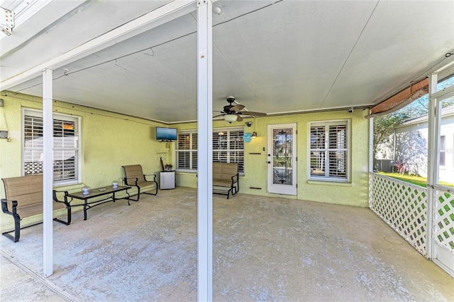 exterior space with a ceiling fan