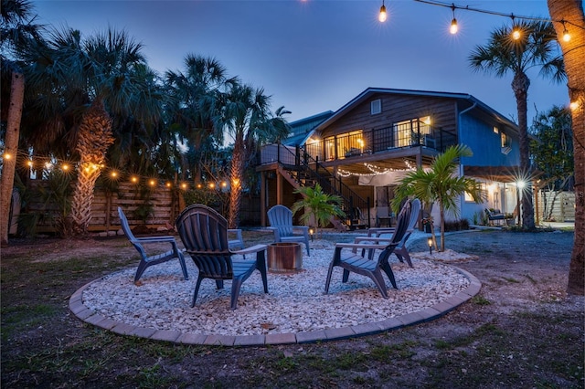 exterior space featuring a patio, a balcony, and stairs