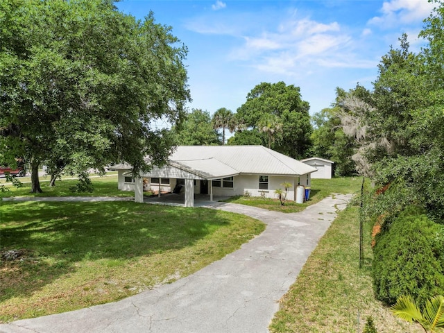 single story home with a carport and a front lawn