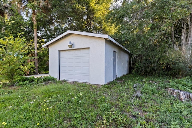 garage featuring a yard