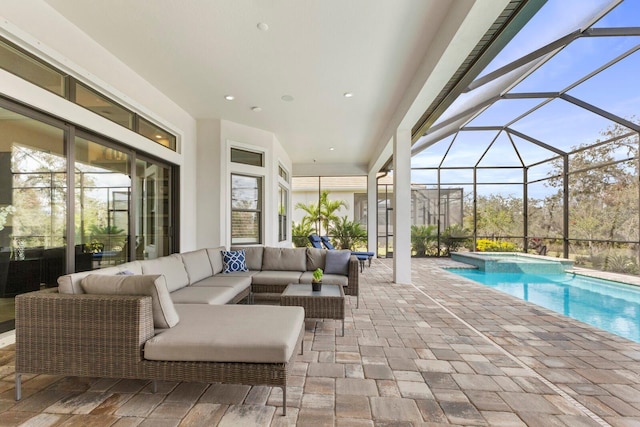 exterior space with an in ground hot tub, an outdoor living space, glass enclosure, and a patio area